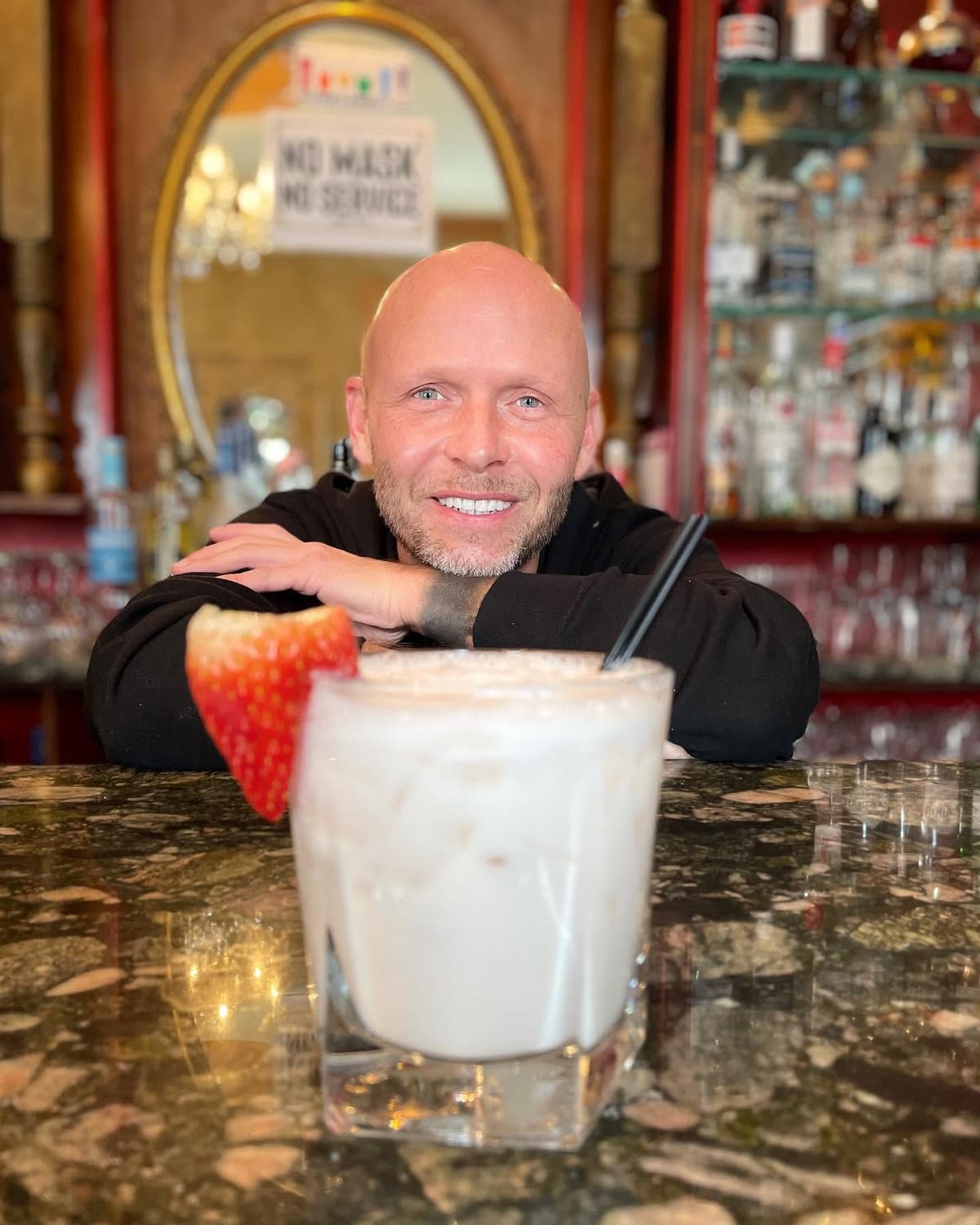 Jimmy behind the bar at Karla's, smiling